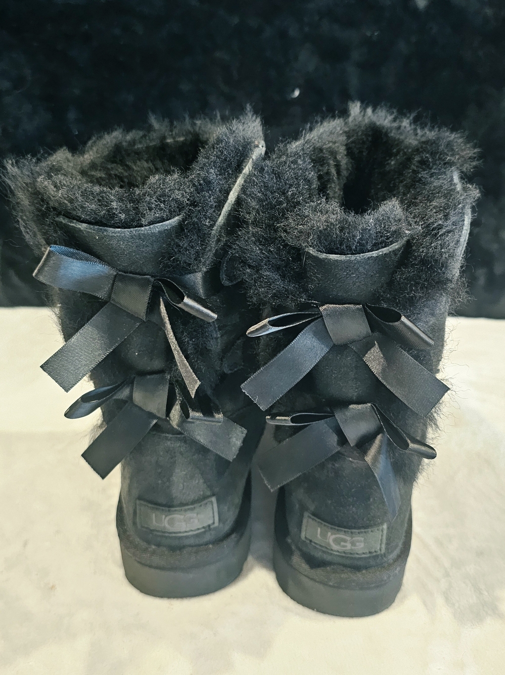 UGG Women's Black Short Sheepskin Boots with Satin Back Bows- Size 7